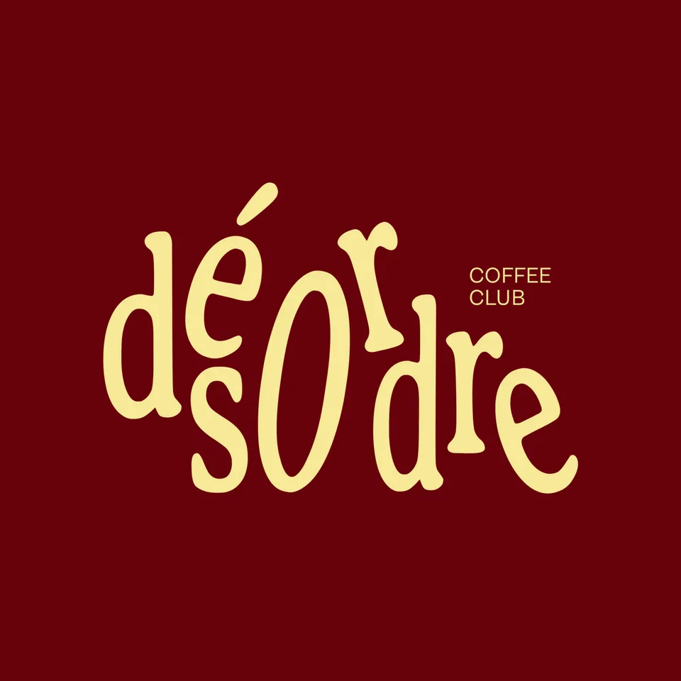 Désordre Coffee Club logo: the word désordre in dancing yellow letters.
