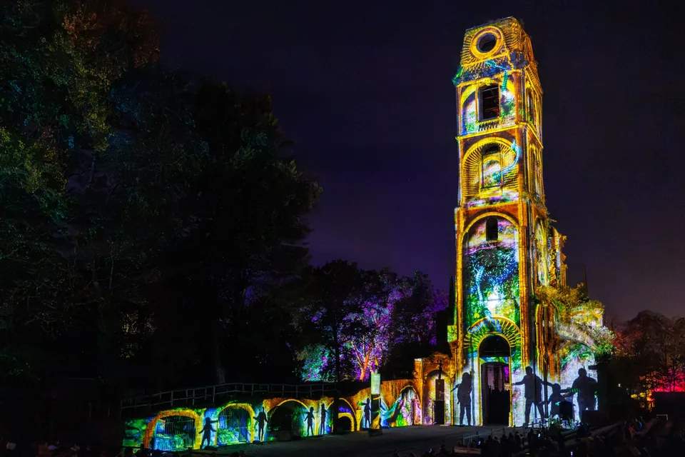 For Halloween, the tower of Cambron Abbey lights up with a projection show at night.