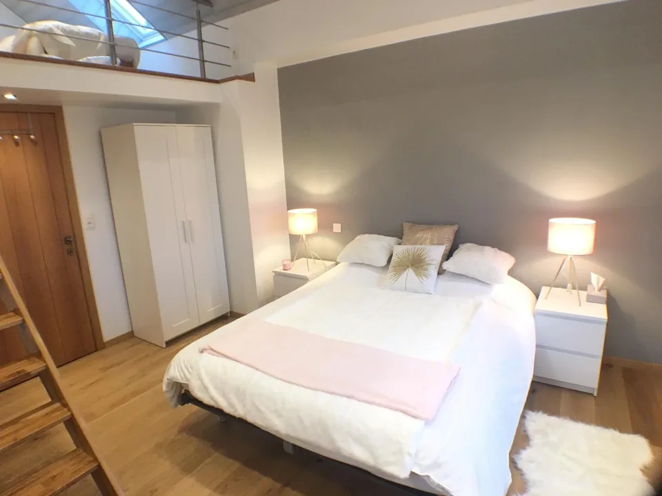 The Pegasus II bedroom: a large double bed and the ladder to the mezzanine.